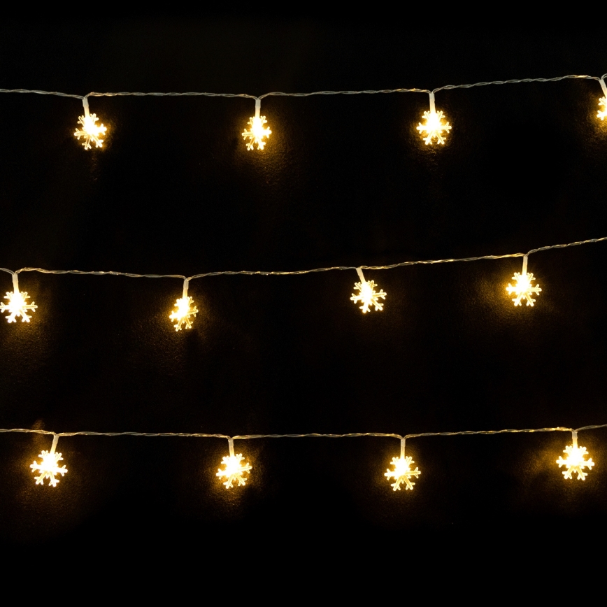 Aigostar - Guirlande de Noël à LED, 10 LED, alimentée par 3 piles AA, 1,5 m, blanc chaud, motif flocons