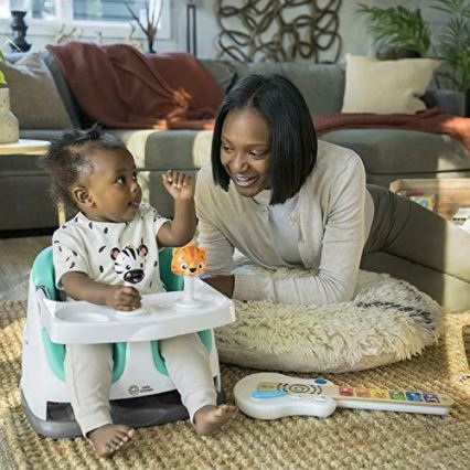 Baby Einstein - Eetkamerstoelkussen met 2 speeltjes 2in1 DINE&DISCOVER