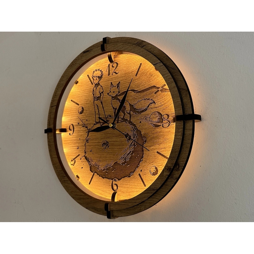 Li-Go 23712/DUB/BAT2 - Horloge LED à intensité réglable avec capteur de mouvement LED/10W/5V 20000 mAh + 1xAA Ø 32 cm chêne/Le Petit Prince